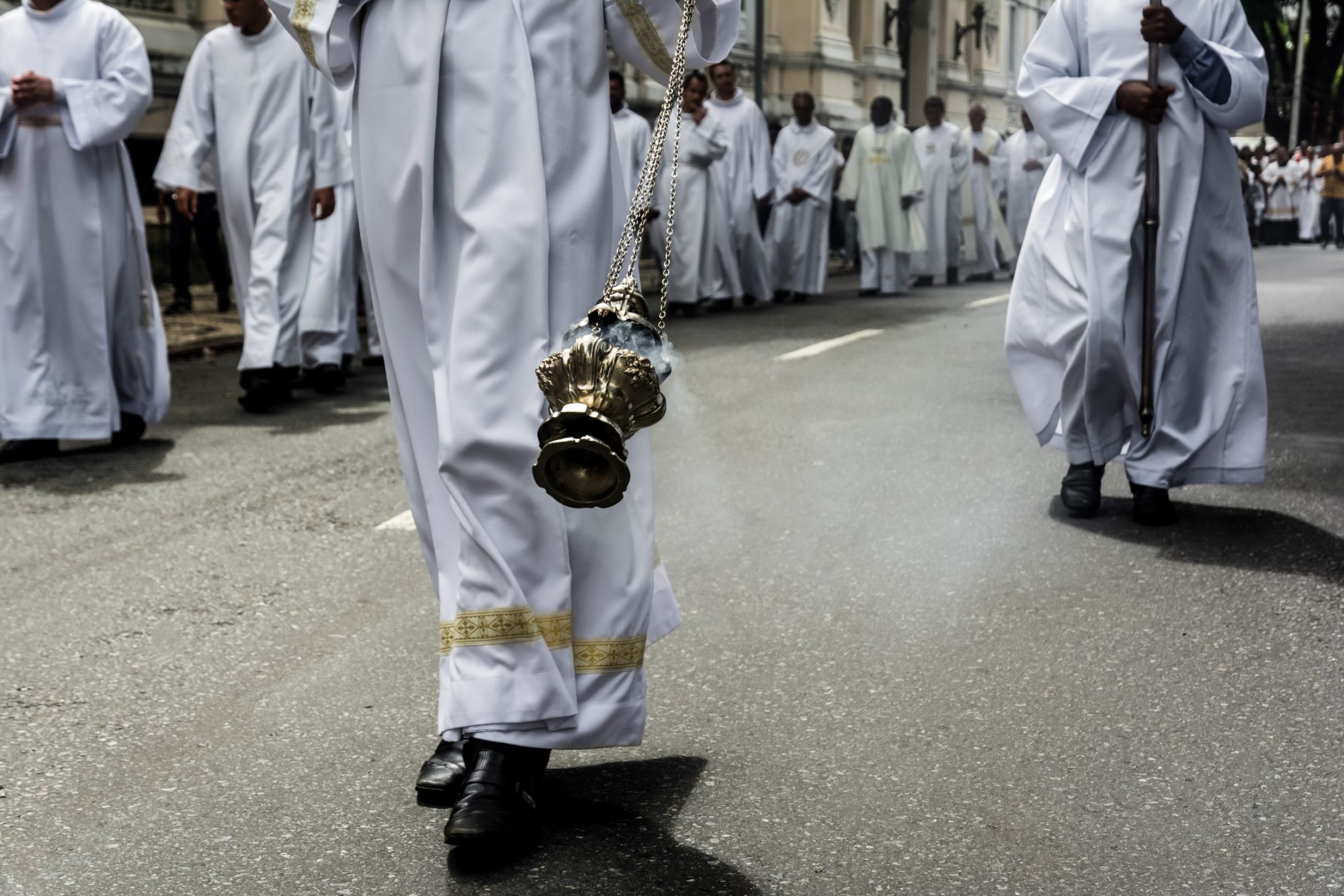 priest-is-using-thurible-exhale-incense-during-corpus-christ-procession-scaled.jpg